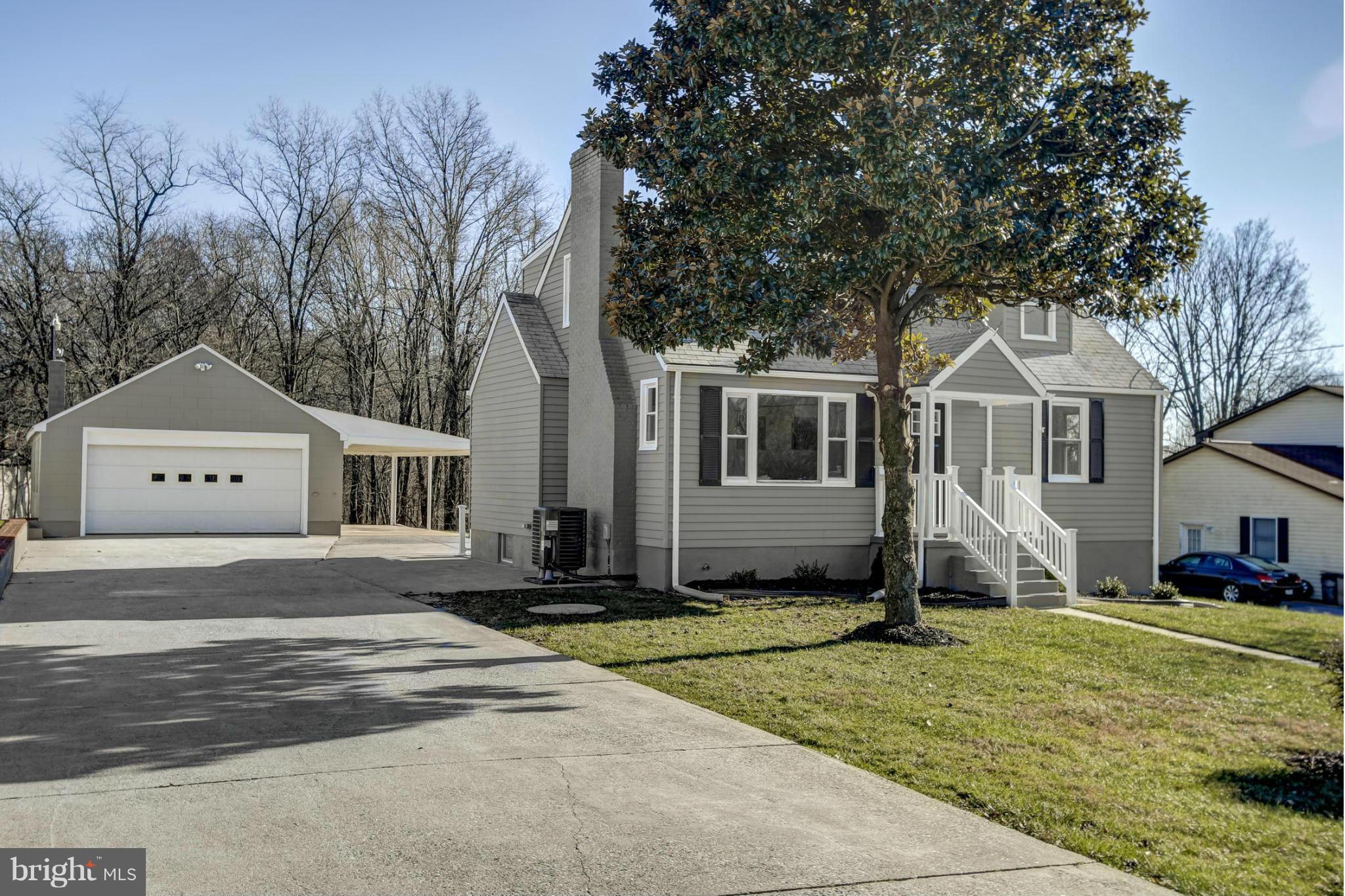 3313 Chapman Road Randallstown, MD 21133 - Photo 2 of 30 a front view of a house with a yard