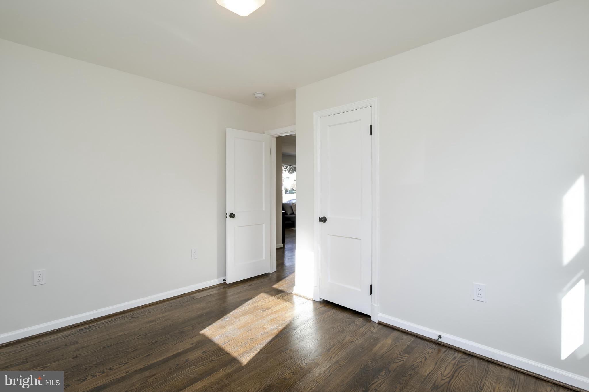3313 Chapman Road Randallstown, MD 21133 - Photo 12 of 30 a view of an empty room and wooden floor