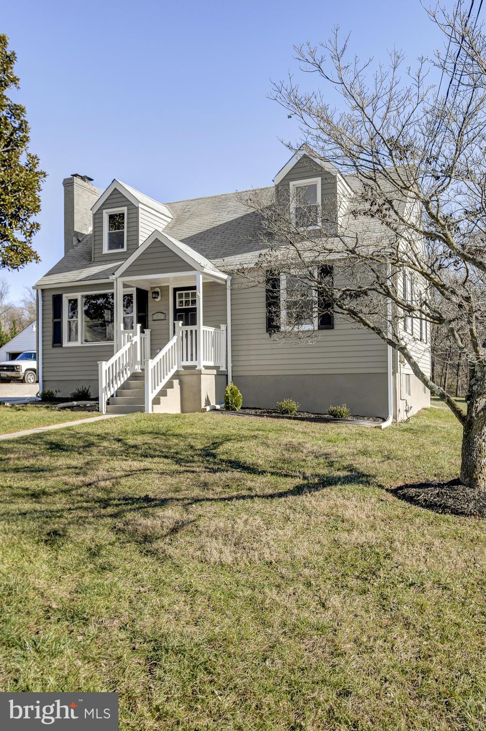 3313 Chapman Road Randallstown, MD 21133 - Photo 3 of 30 a front view of a house with a yard