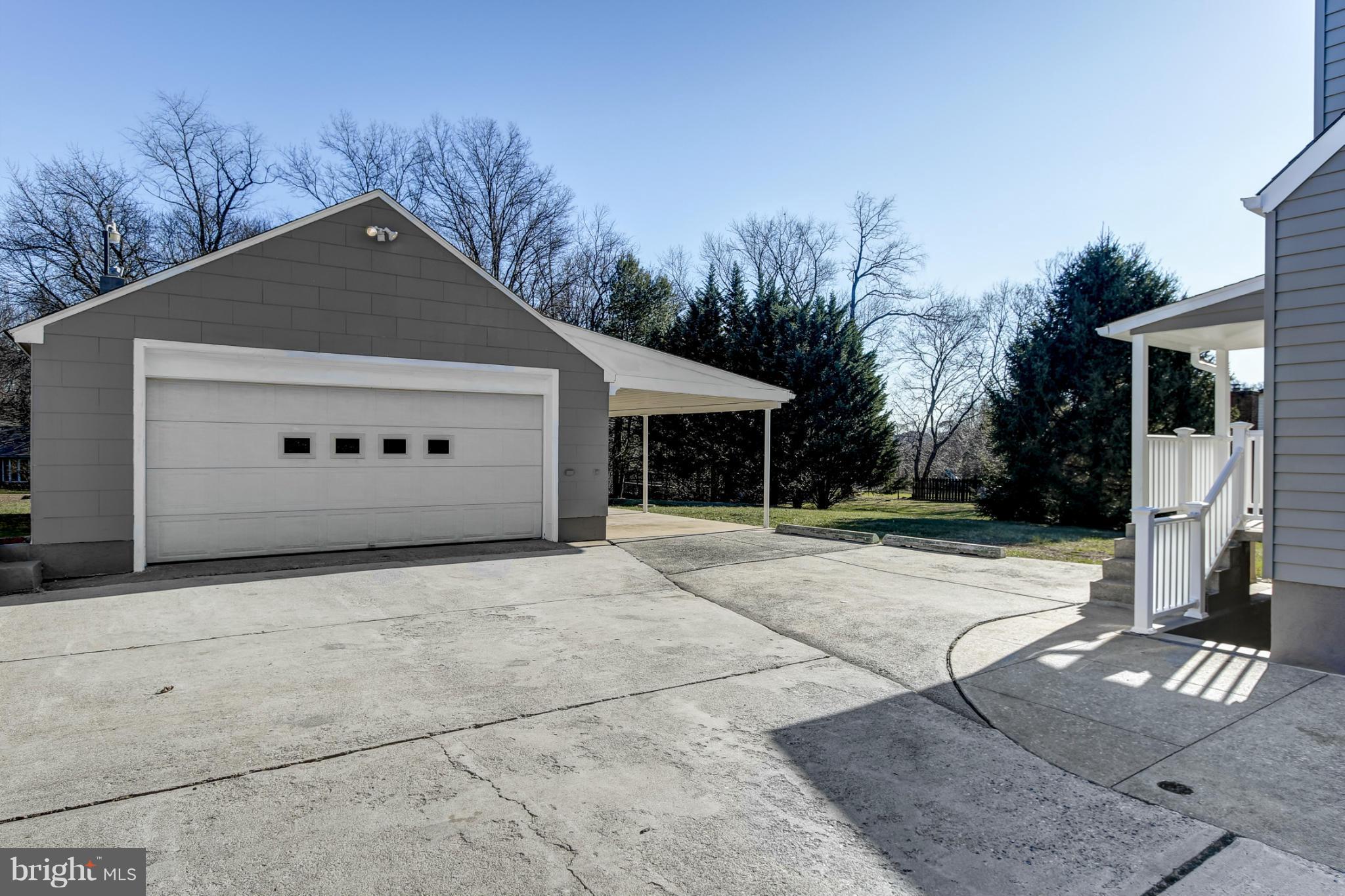 3313 Chapman Road Randallstown, MD 21133 - Photo 24 of 30 a front view of a house with a yard and garage