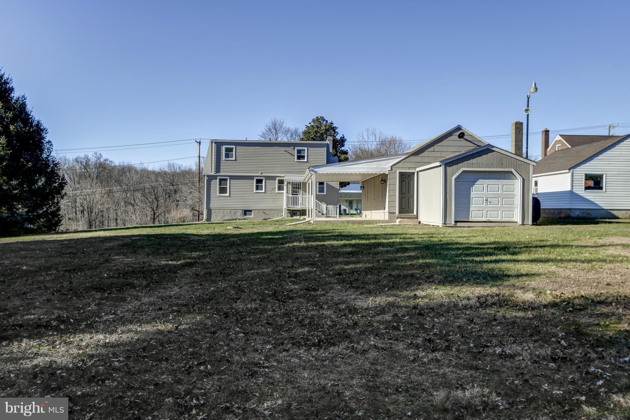 3313 Chapman Road Randallstown, MD 21133 - Photo 30 of 30 a front view of a house with a yard