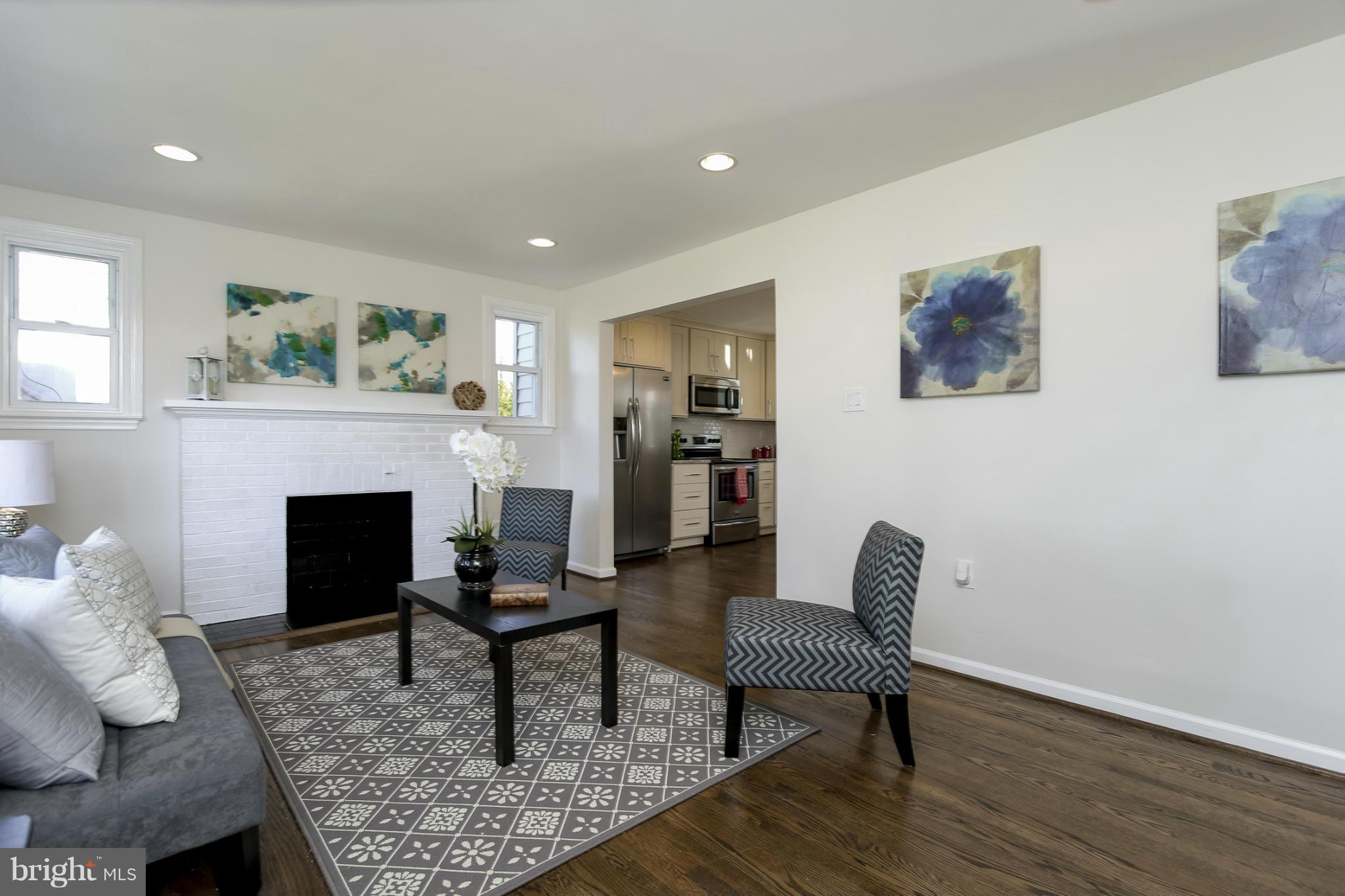 3313 Chapman Road Randallstown, MD 21133 - Photo 5 of 30 a living room with furniture and a fireplace