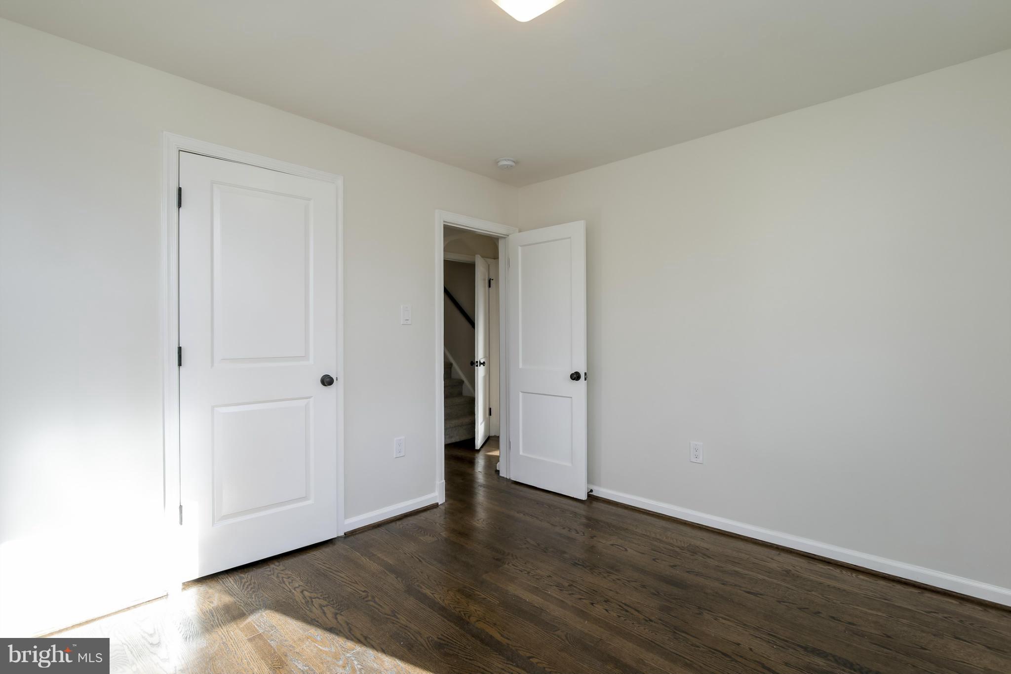 3313 Chapman Road Randallstown, MD 21133 - Photo 10 of 30 a view of an empty room with wooden floor