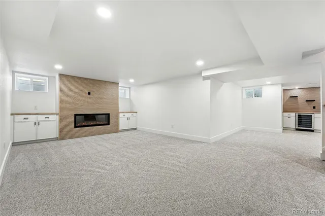 a view of empty room with a fireplace