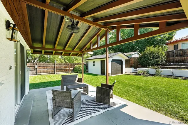 a house view with swimming pool garden and patio