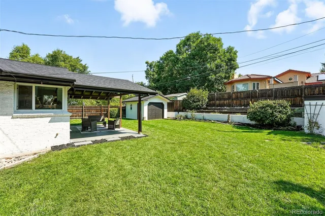 a view of a house with a yard porch and sitting area