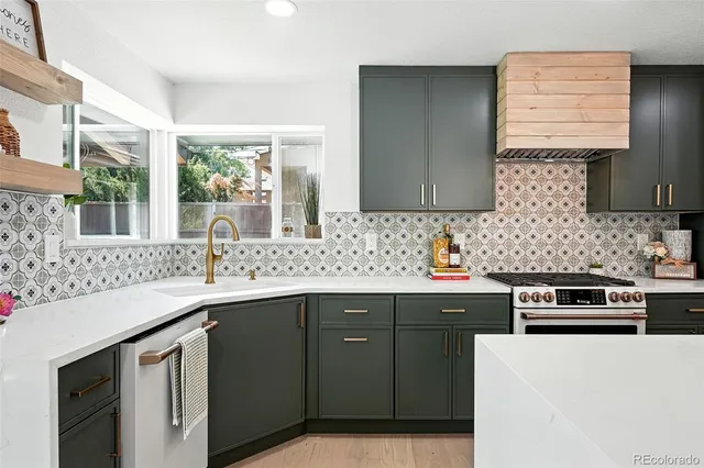 a kitchen with a sink stove and cabinets