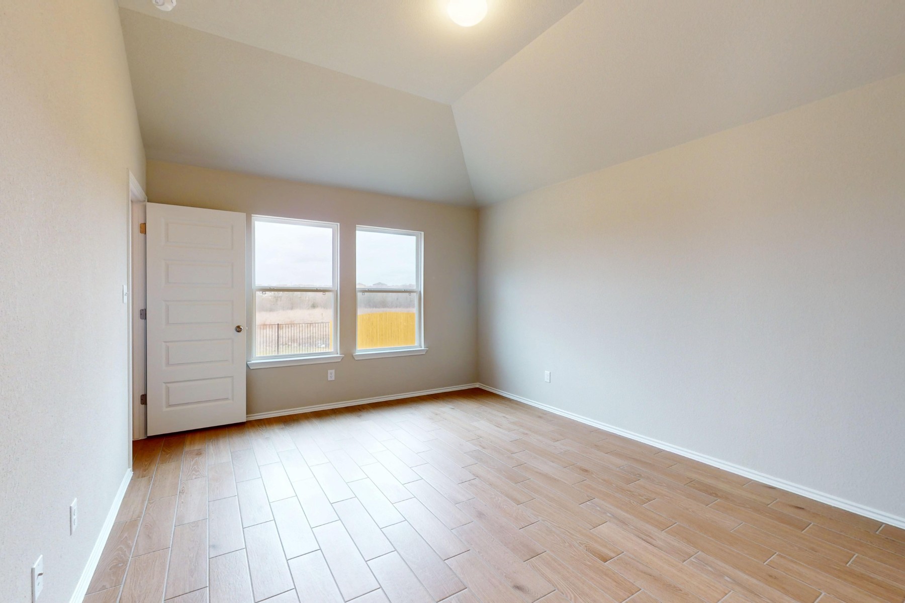 19913 Schatz Way Manor, TX 78653 - Photo 11 of 37 an empty room with wooden floor and windows