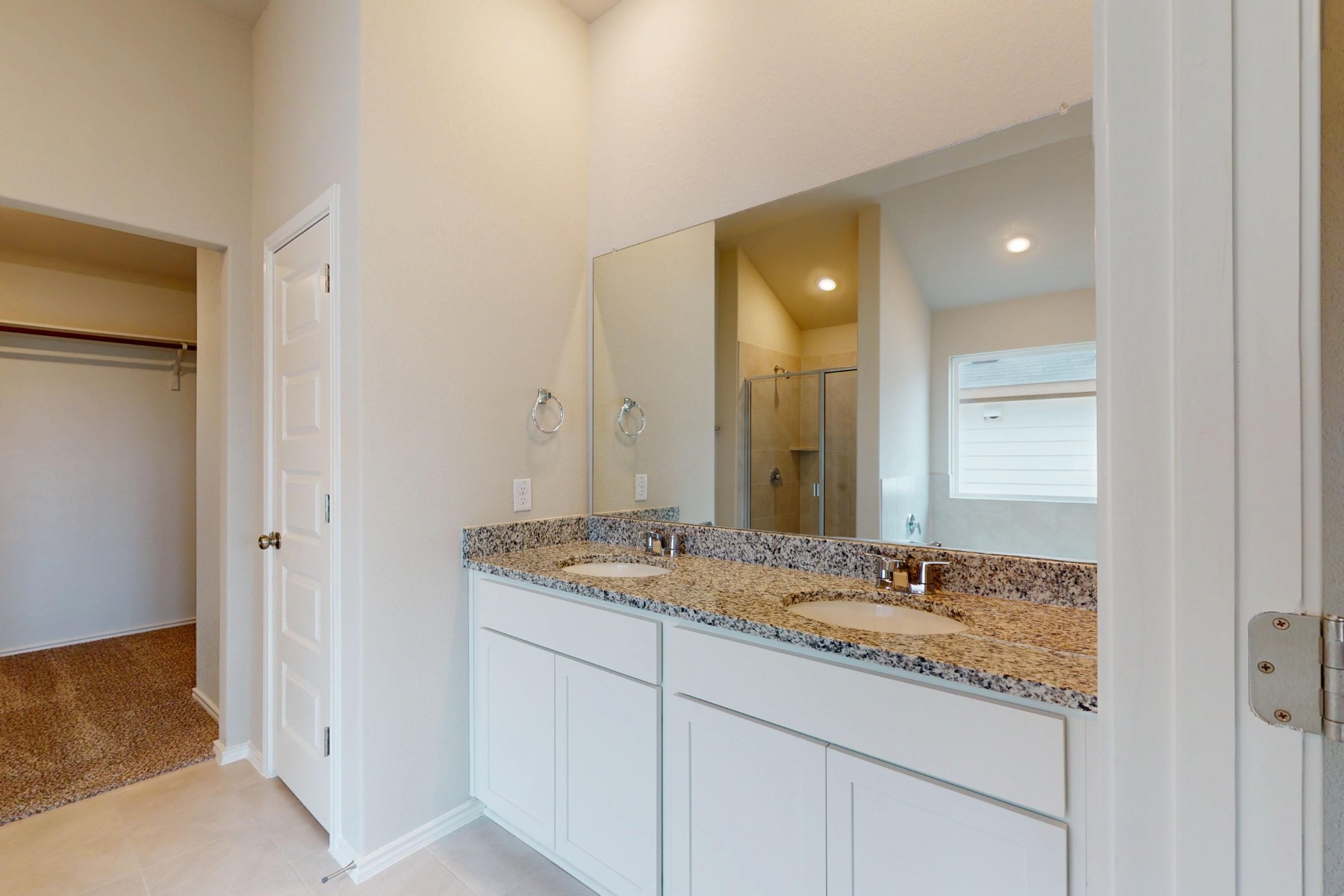 19913 Schatz Way Manor, TX 78653 - Photo 16 of 37 a bathroom with a granite countertop sink and a mirror