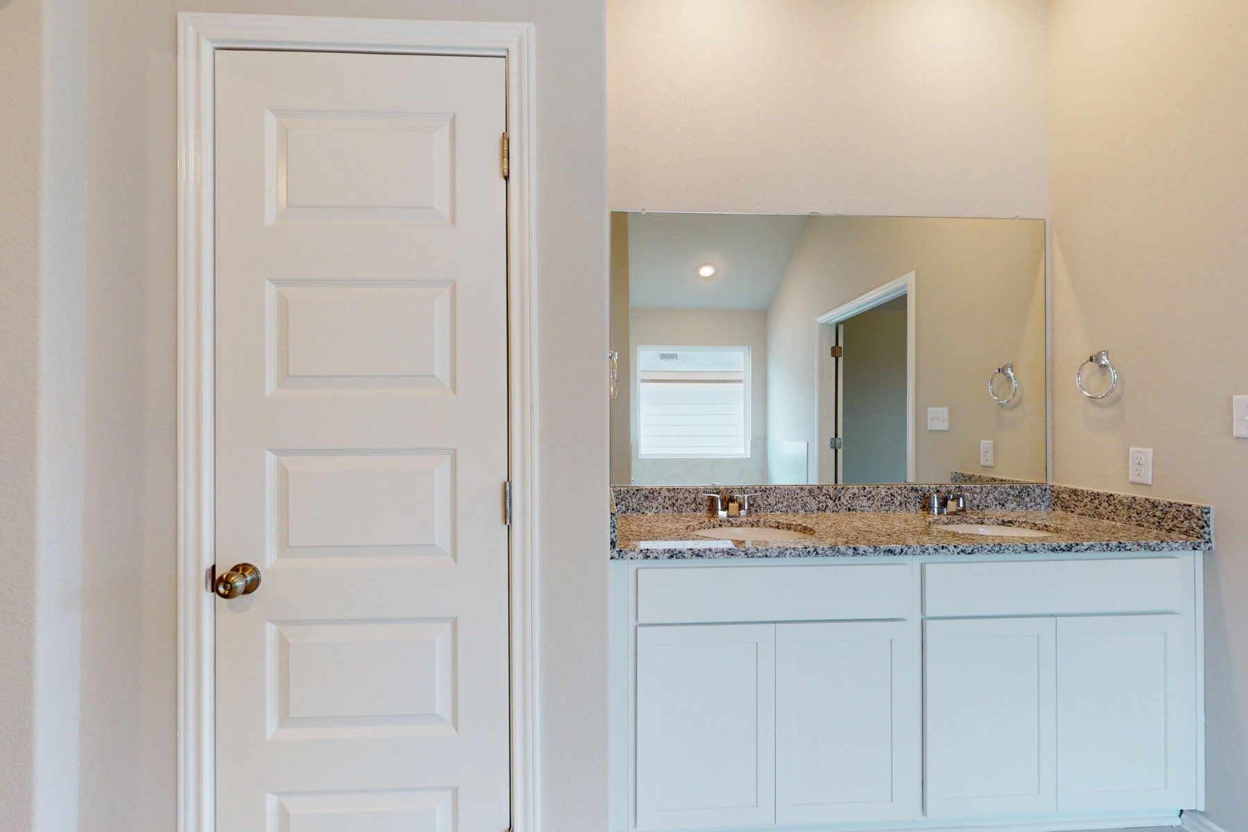 19913 Schatz Way Manor, TX 78653 - Photo 17 of 37 a bathroom with a granite countertop sink and a mirror