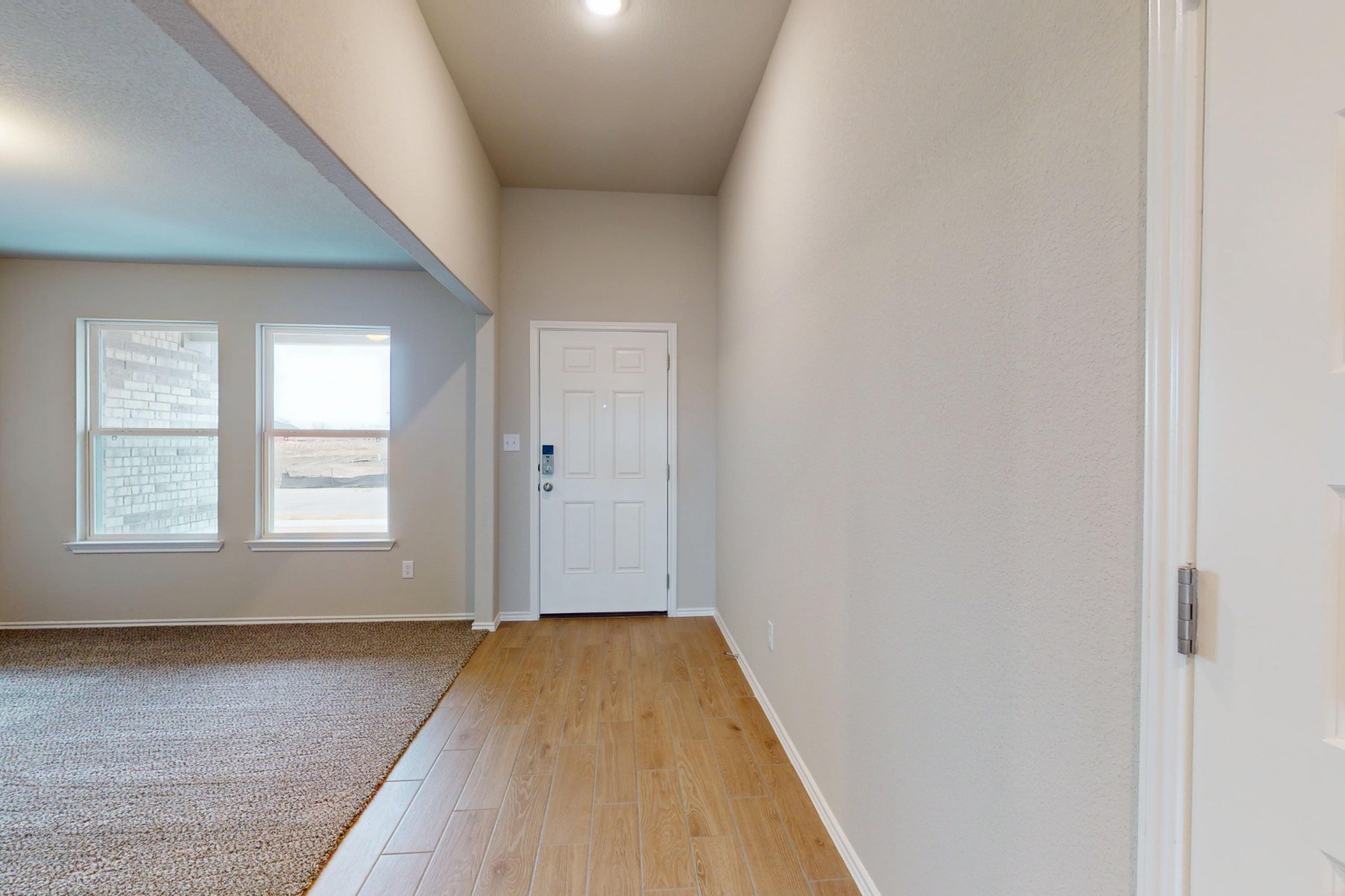 19913 Schatz Way Manor, TX 78653 - Photo 19 of 37 an empty room with wooden floor and windows
