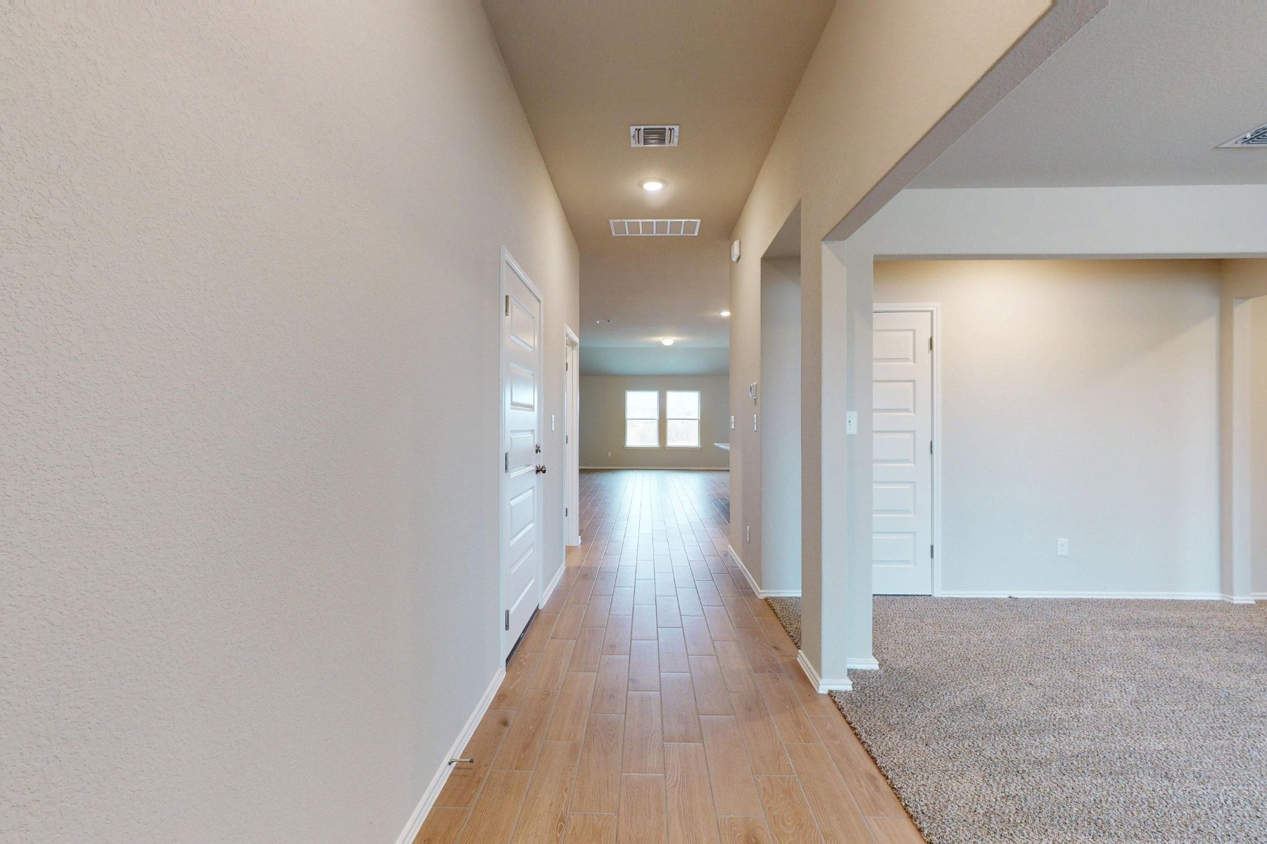 19913 Schatz Way Manor, TX 78653 - Photo 23 of 37 a view of a hallway with wooden floor