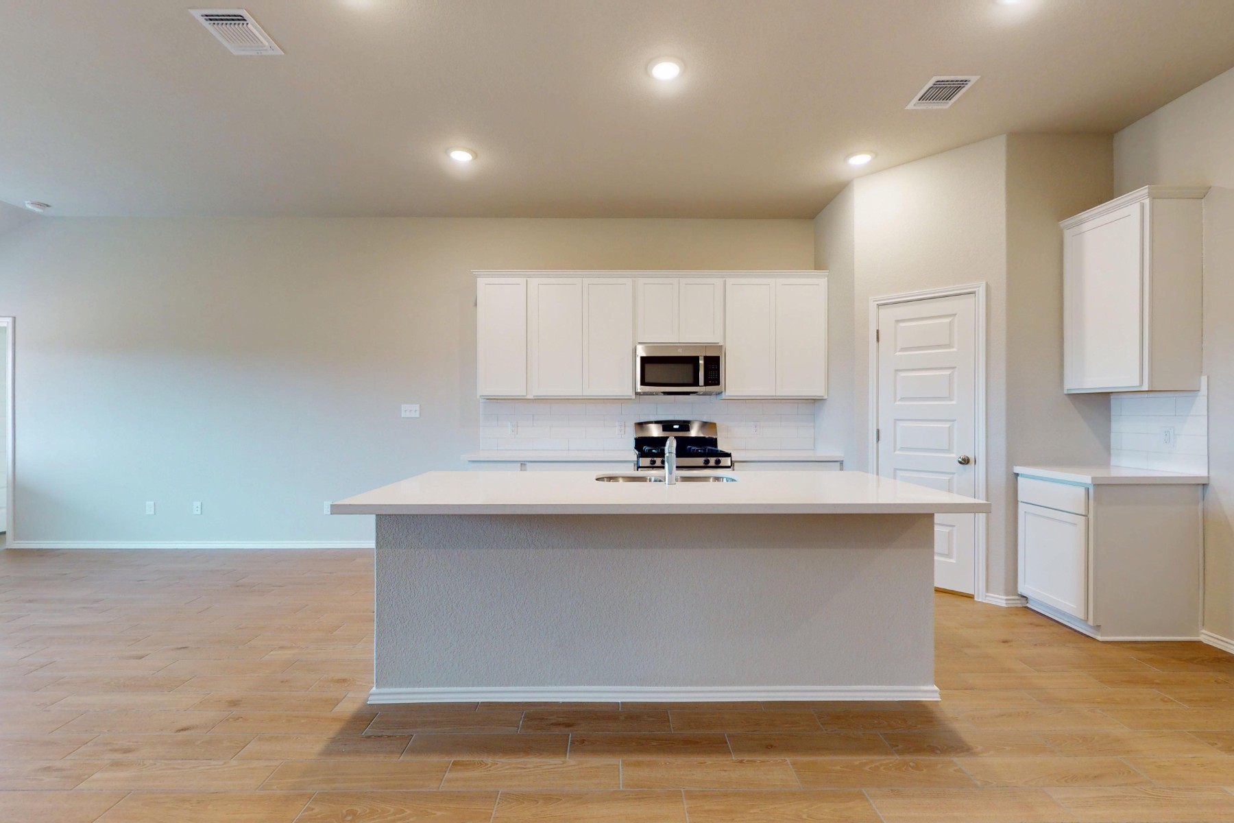 19913 Schatz Way Manor, TX 78653 - Photo 4 of 37 a view of kitchen with stainless steel appliances granite countertop a sink a stove and a refrigerator