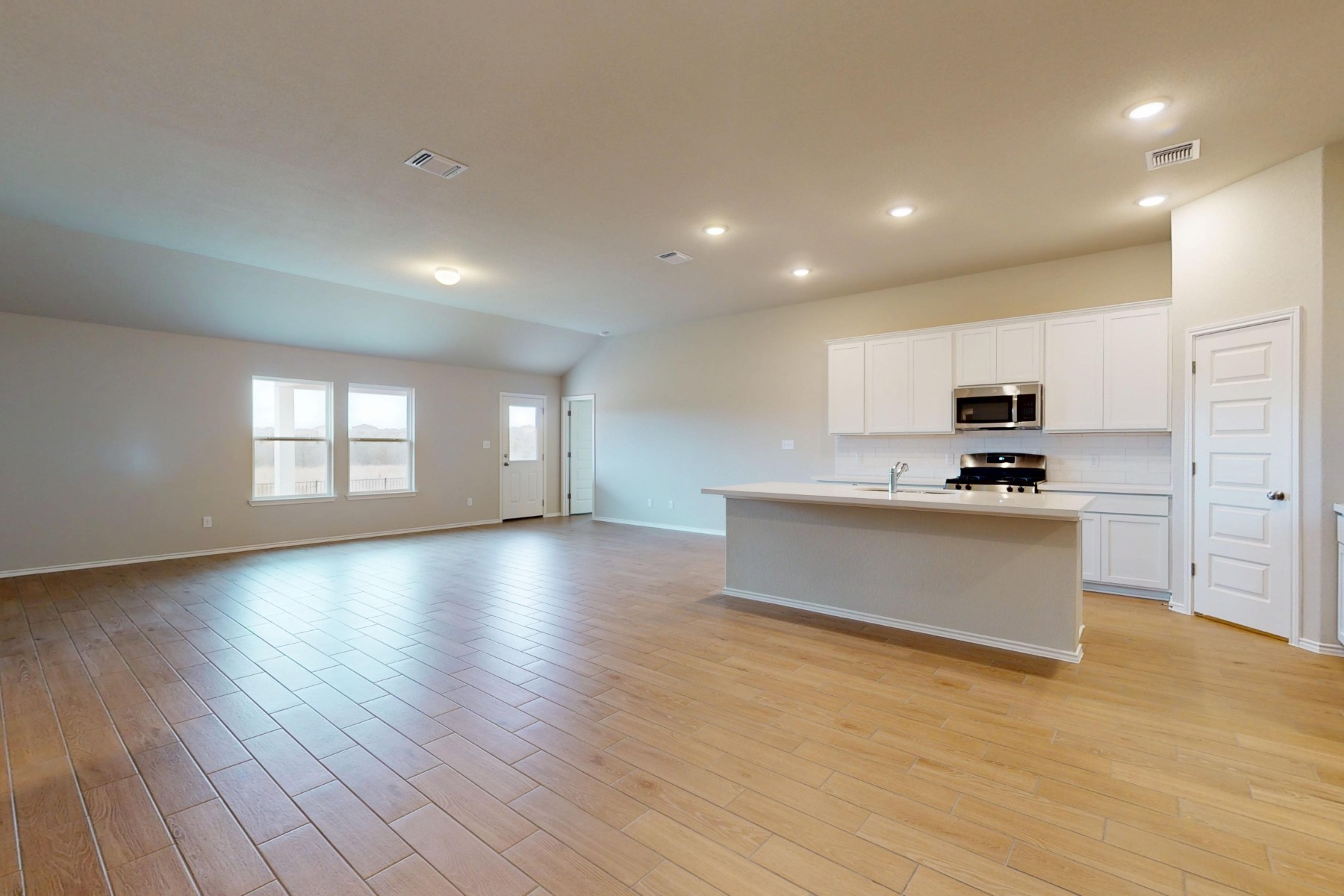 19913 Schatz Way Manor, TX 78653 - Photo 6 of 37 a view of kitchen with cabinets and wooden floor