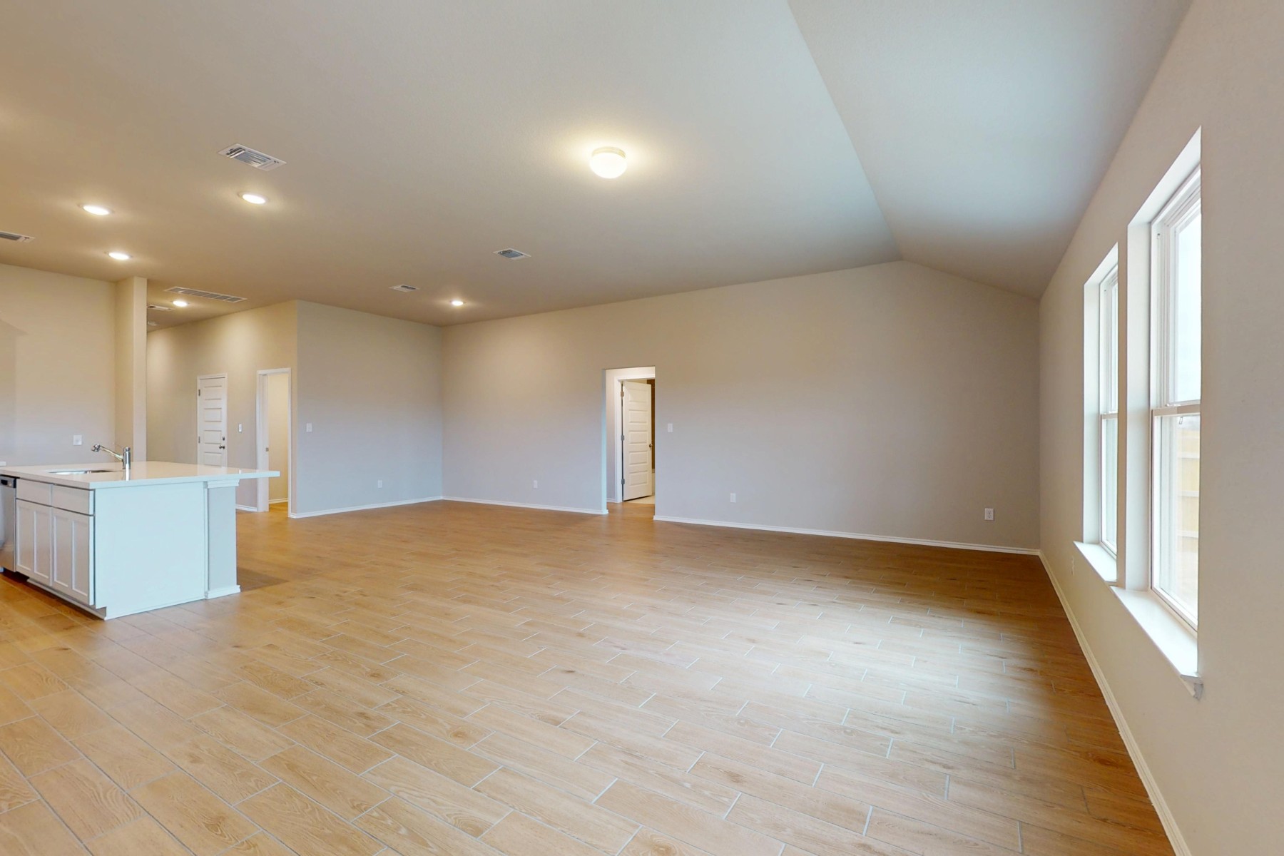 19913 Schatz Way Manor, TX 78653 - Photo 10 of 37 a view of empty room with wooden floor and fan
