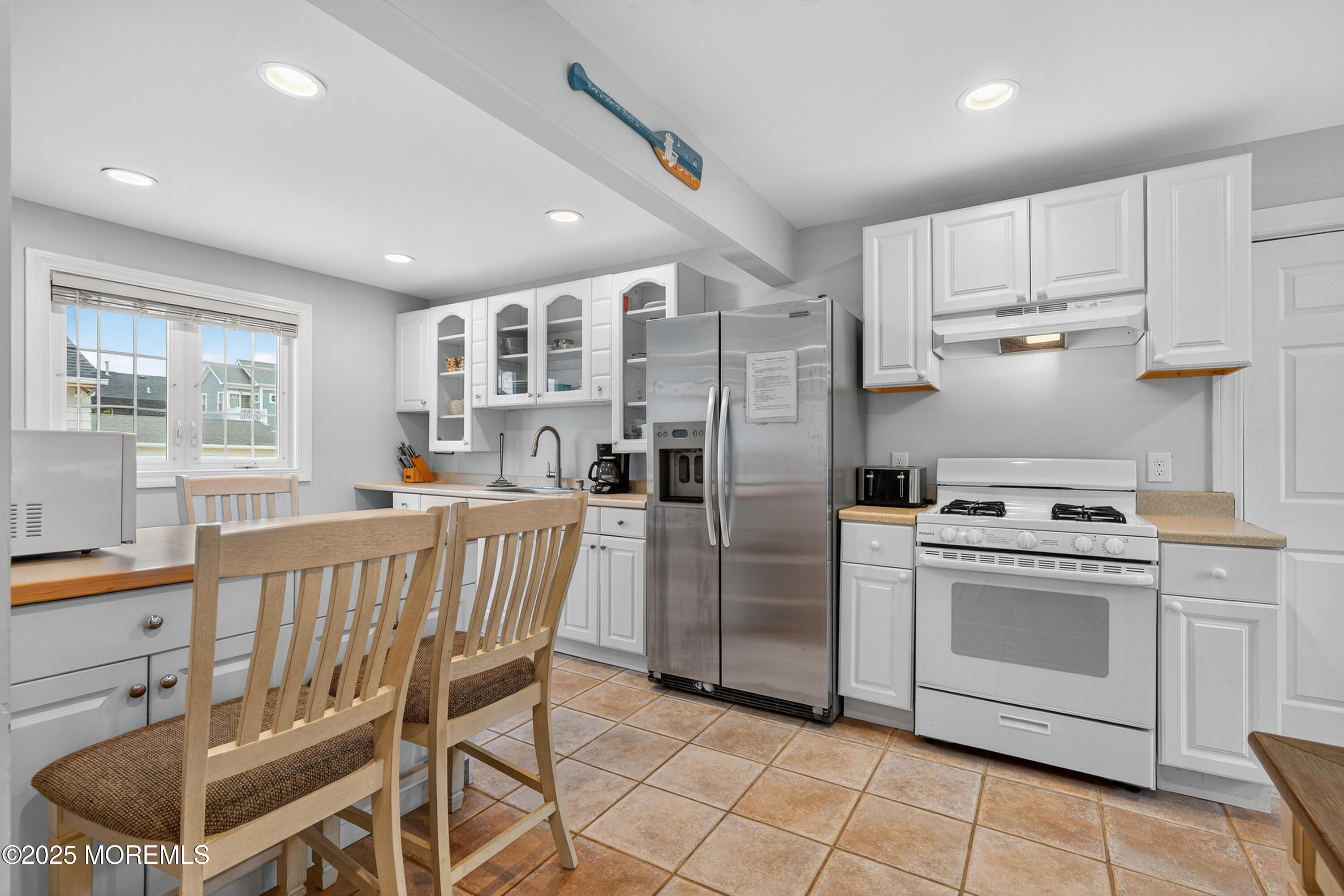 B19 Haddonfield Avenue Lavallette, NJ 08735 - Photo 6 of 34 a kitchen with stainless steel appliances a stove a sink dishwasher a refrigerator and cabinets with wooden floor
