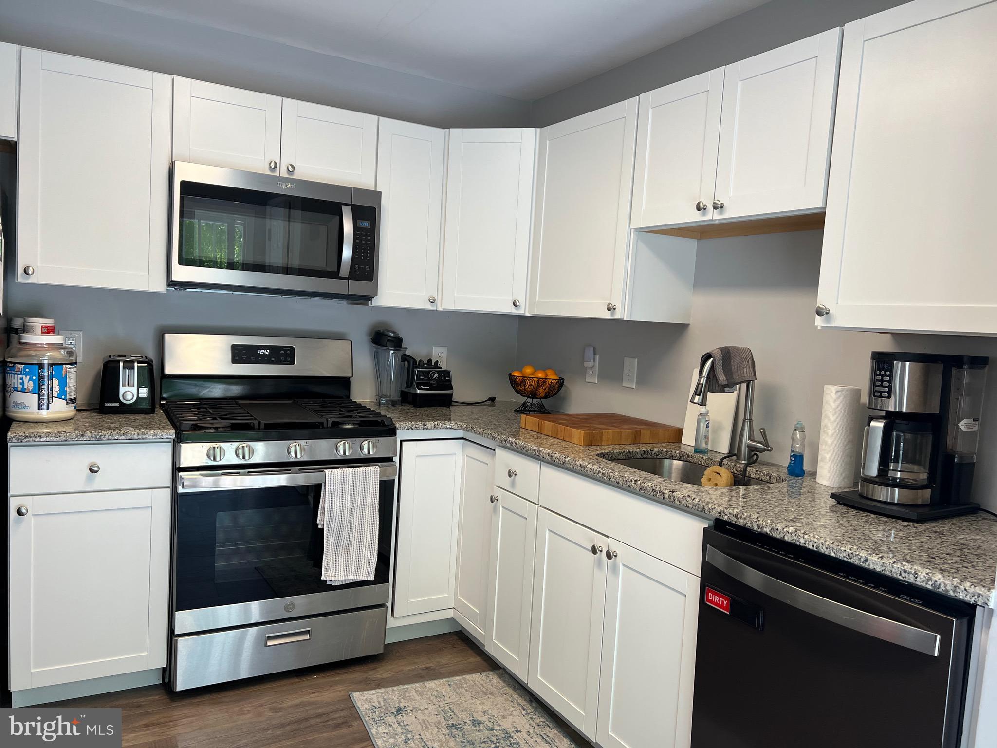 763 Barton Run Boulevard Marlton, NJ 08053 - Photo 3 of 19 a kitchen with granite countertop white cabinets and stainless steel appliances