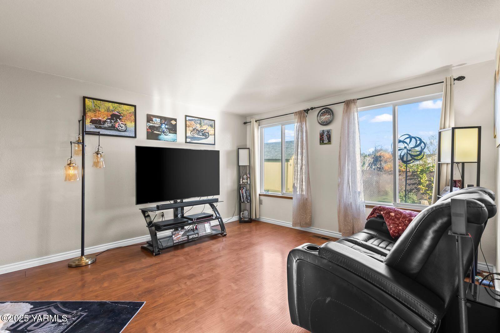 307 South 76th Avenue Yakima, WA 98908 - Photo 17 of 36 a living room with furniture and a flat screen tv