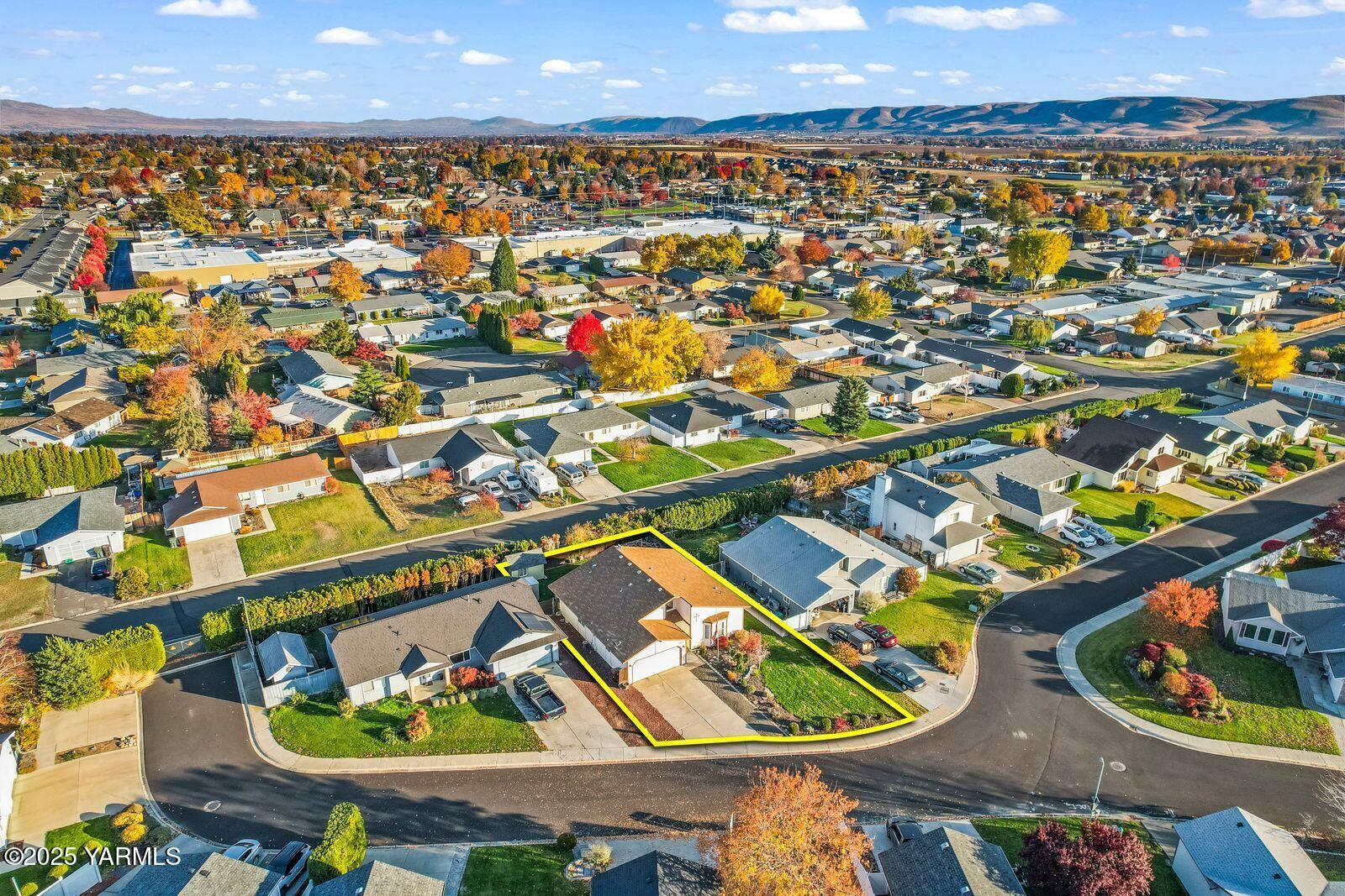 307 South 76th Avenue Yakima, WA 98908 - Photo 29 of 36 an aerial view of a house with swimming pool and outdoor seating