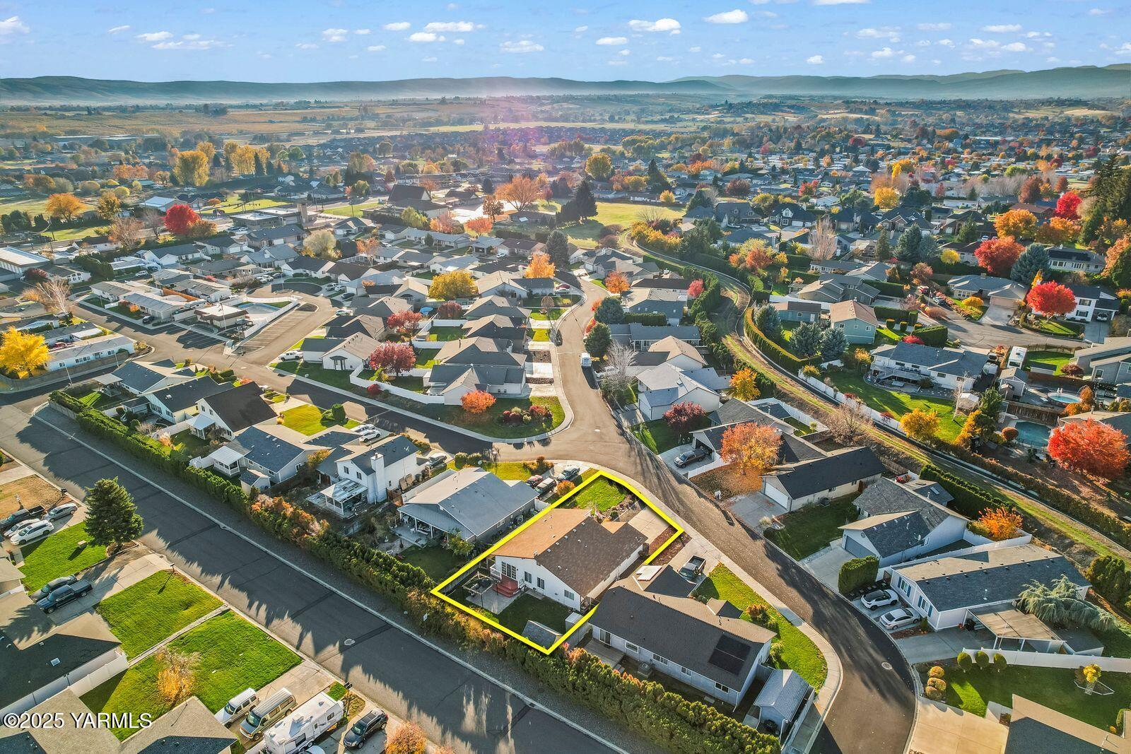 307 South 76th Avenue Yakima, WA 98908 - Photo 32 of 36 an aerial view of residential houses with outdoor space