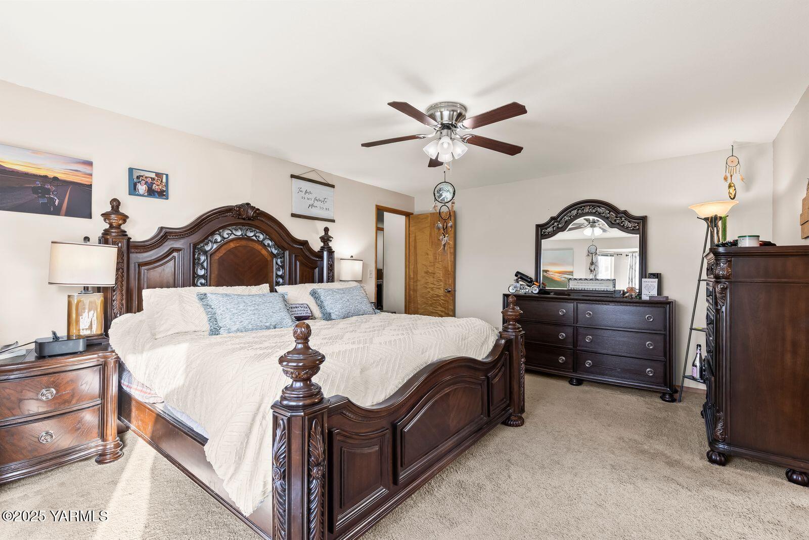 307 South 76th Avenue Yakima, WA 98908 - Photo 8 of 36 a bed room with a bed and a dresser
