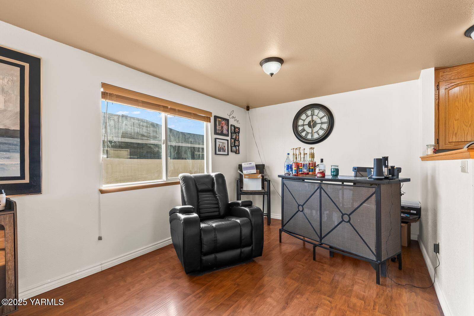 307 South 76th Avenue Yakima, WA 98908 - Photo 9 of 36 a living room with furniture and a large window