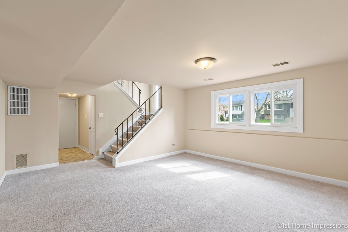 17012 Magnolia Drive Hazel Crest, IL 60429 - Photo 15 of 23 a view of an empty room with windows