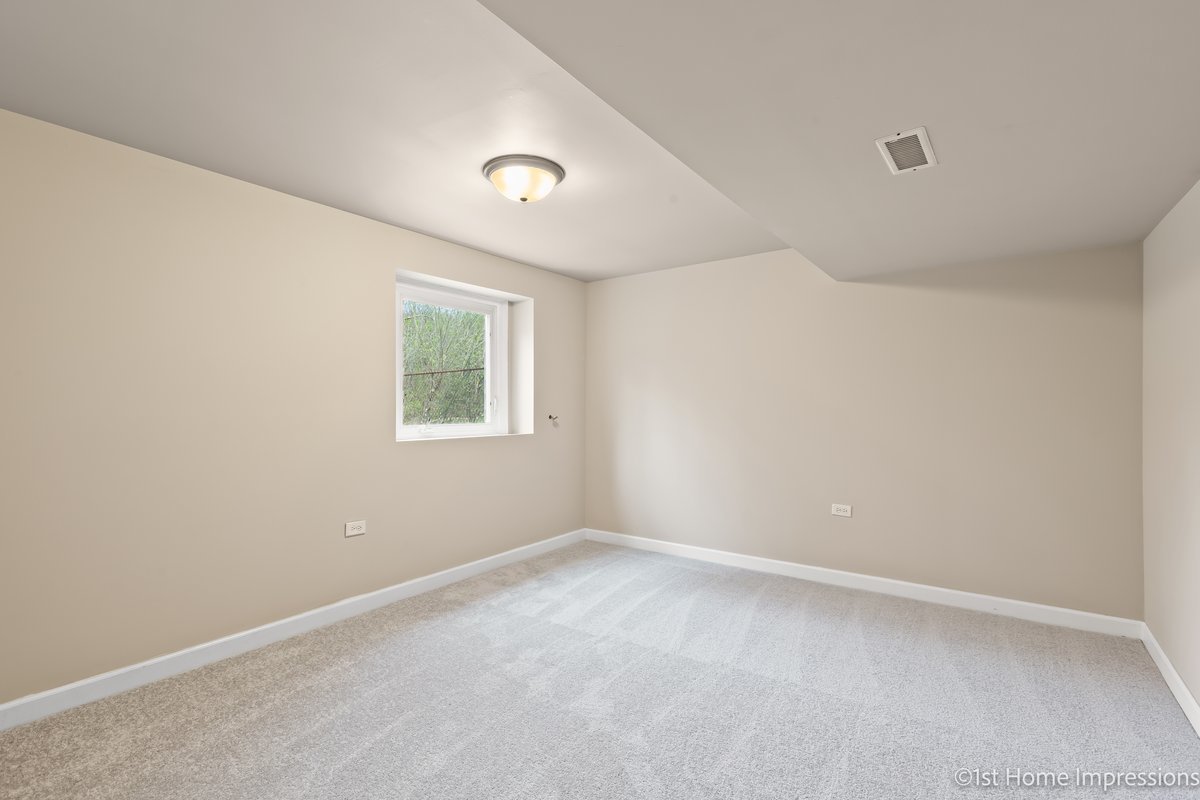 17012 Magnolia Drive Hazel Crest, IL 60429 - Photo 17 of 23 an empty room with a window