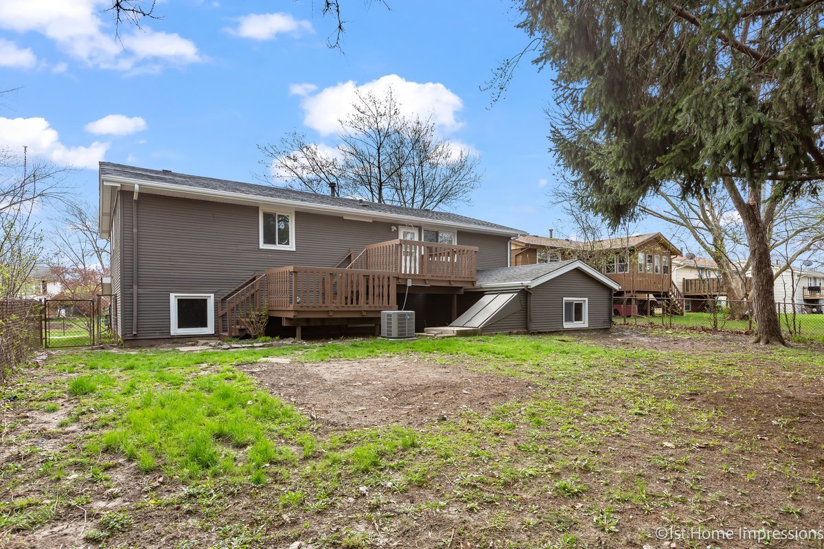 17012 Magnolia Drive Hazel Crest, IL 60429 - Photo 22 of 23 a house that has a tree in front of the house