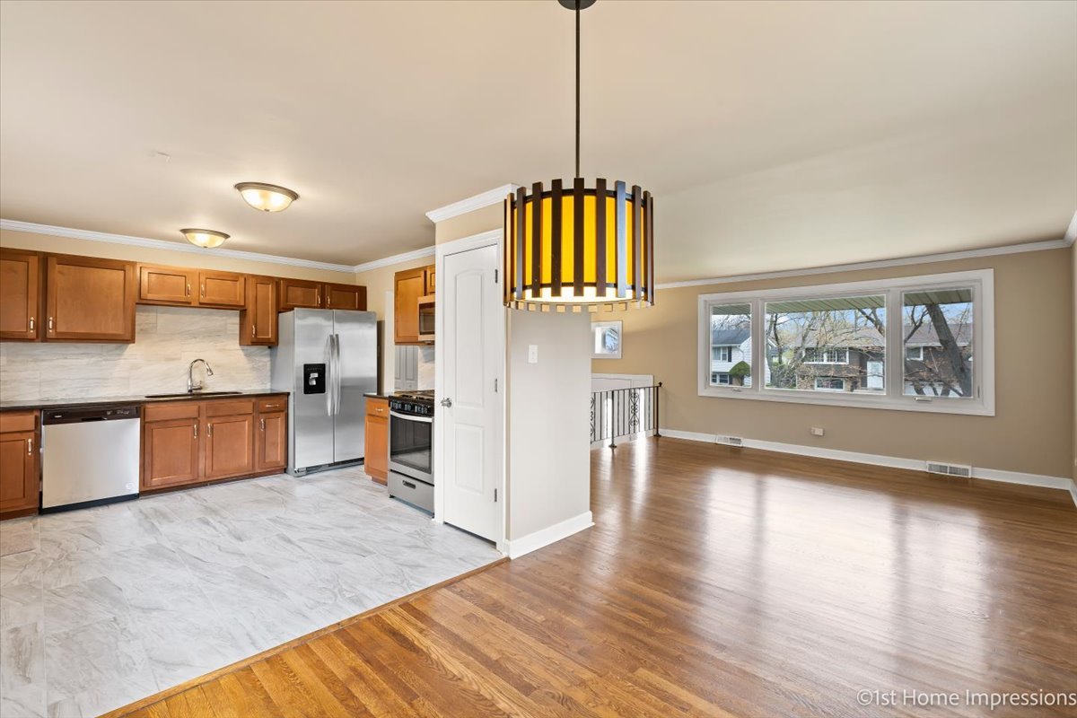 17012 Magnolia Drive Hazel Crest, IL 60429 - Photo 5 of 23 a view of kitchen with cabinets and wooden floor