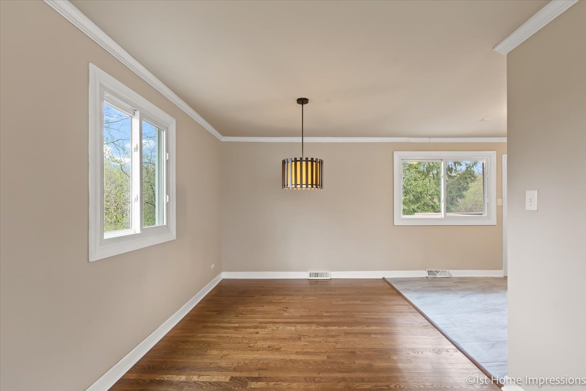17012 Magnolia Drive Hazel Crest, IL 60429 - Photo 6 of 23 a view of a room with wooden floor and windows