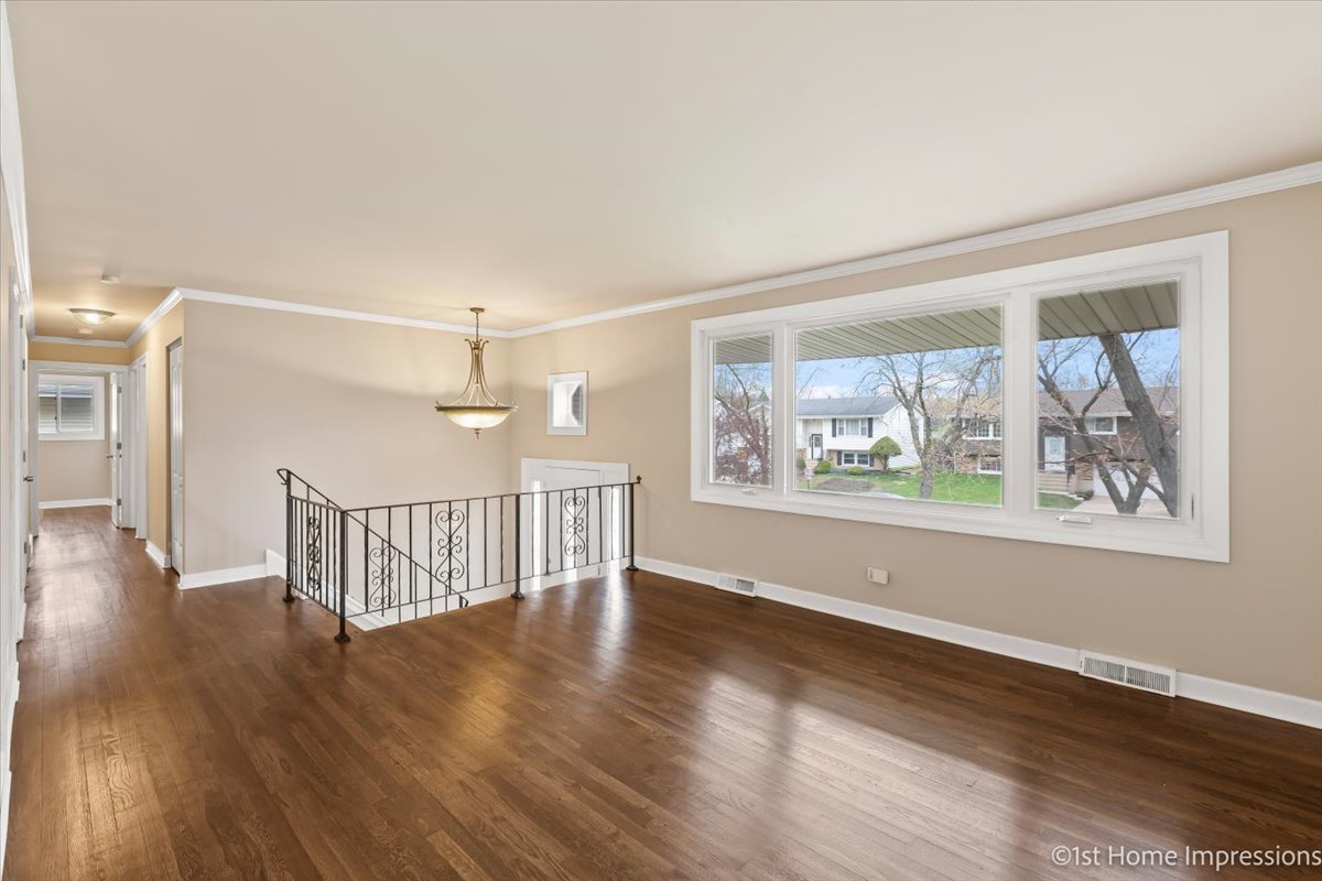 17012 Magnolia Drive Hazel Crest, IL 60429 - Photo 9 of 23 a view of an empty room with wooden floor and a window