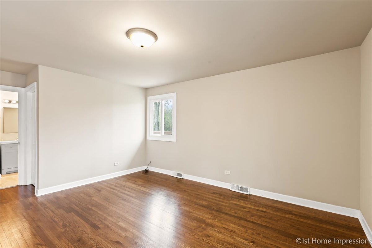17012 Magnolia Drive Hazel Crest, IL 60429 - Photo 10 of 23 a view of a room with wooden floor and window