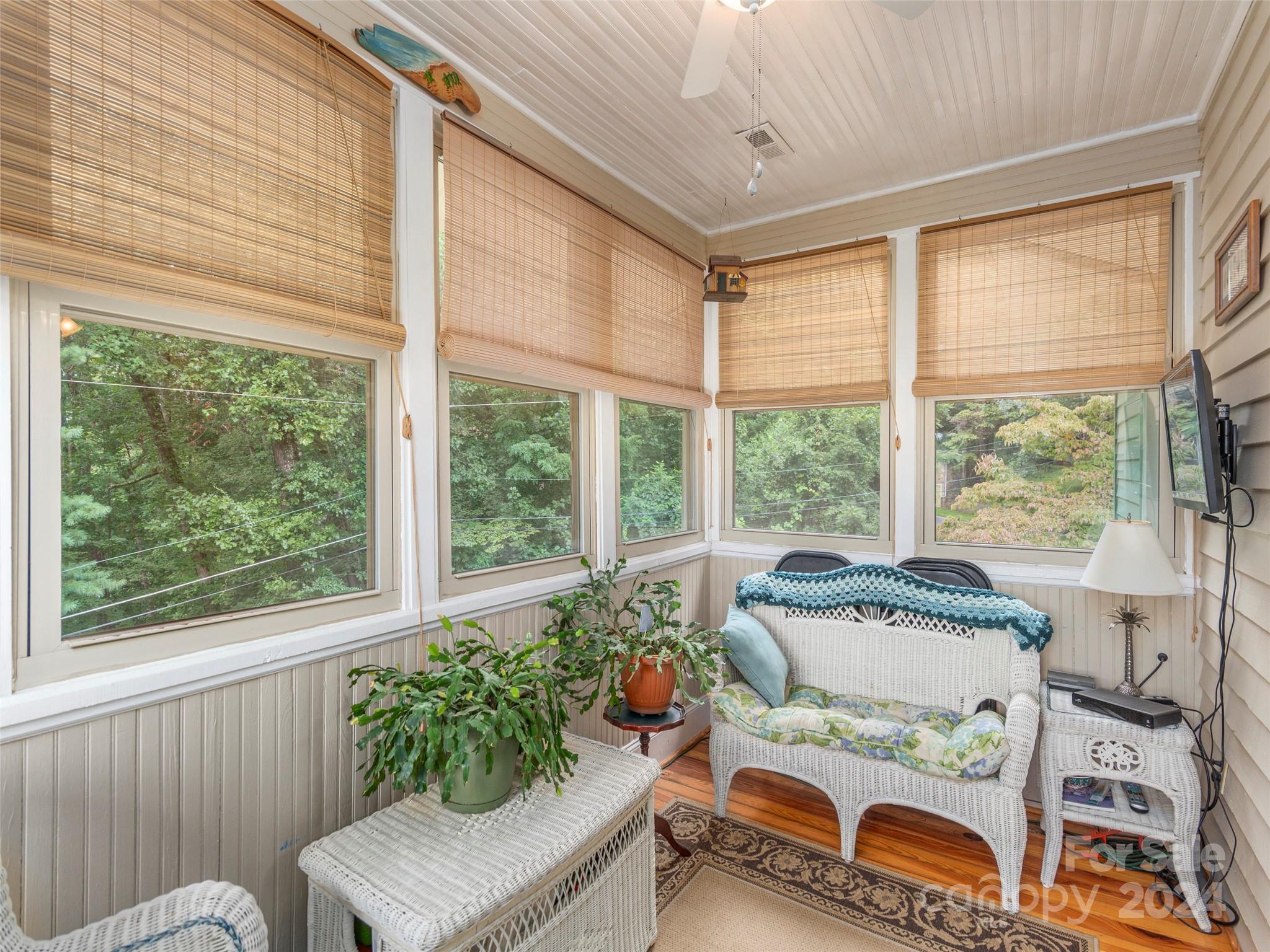 18 Kilgore Road Waynesville, NC 28785 - Photo 24 of 32 a living room filled with furniture and a potted plant