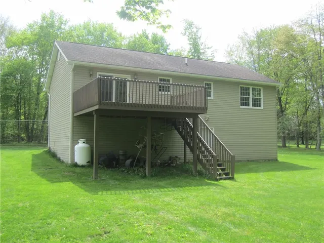 a view of an chairs and table in the garden