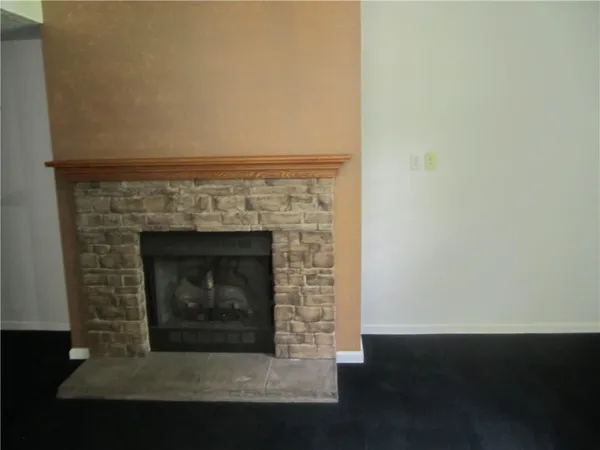 a living room with a fireplace