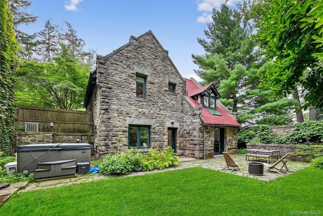 a view of hall way with furniture and wooden floor