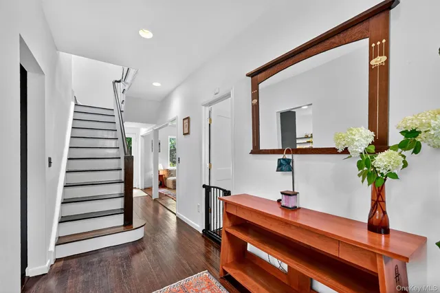 a backyard of a house with table and chairs