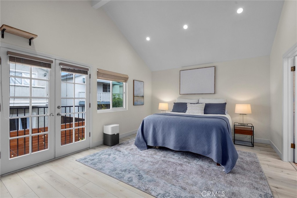 1727 Spreckels Lane Redondo Beach, CA 90278 - Photo 11 of 35 a spacious bedroom with a bed and wooden floor