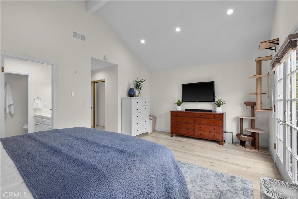 1727 Spreckels Lane Redondo Beach, CA 90278 - Photo 12 of 35 a bedroom with a bed and a flat screen tv