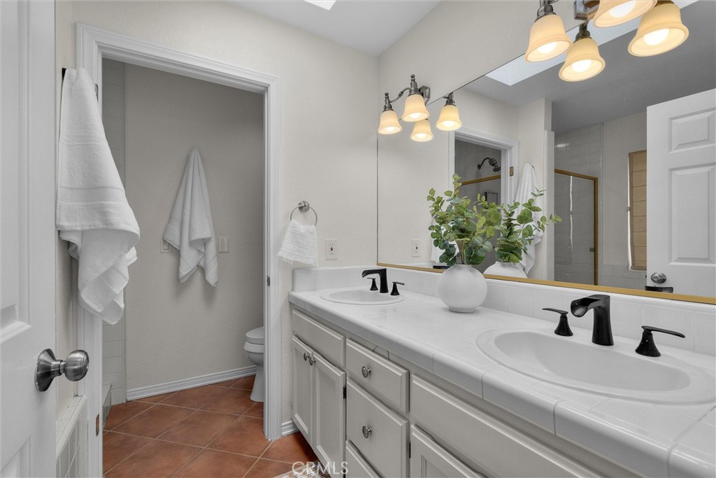 1727 Spreckels Lane Redondo Beach, CA 90278 - Photo 15 of 35 a bathroom with a sink and a mirror