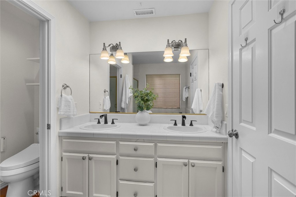1727 Spreckels Lane Redondo Beach, CA 90278 - Photo 16 of 35 a bathroom with a sink vanity and a mirror