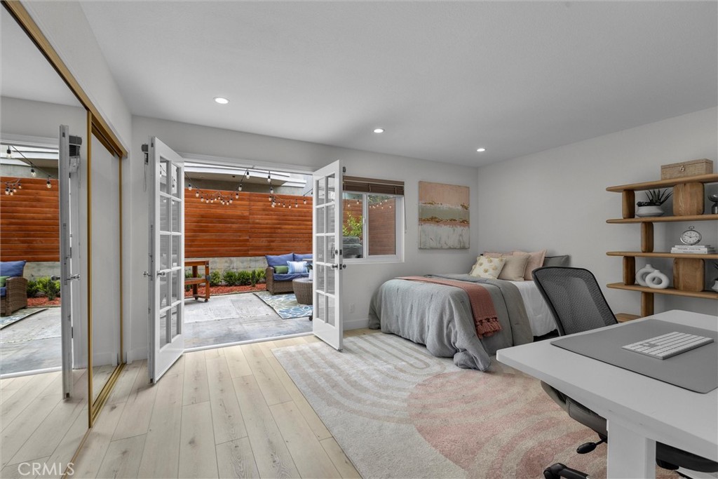 1727 Spreckels Lane Redondo Beach, CA 90278 - Photo 22 of 35 a spacious bedroom with two beds and glass door