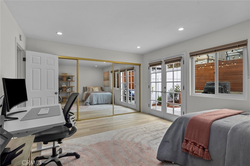 1727 Spreckels Lane Redondo Beach, CA 90278 - Photo 23 of 35 a bedroom with a bed and large windows