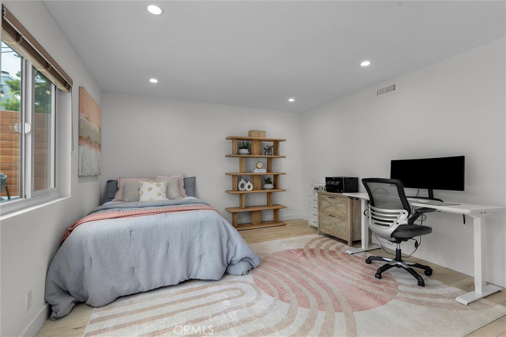 1727 Spreckels Lane Redondo Beach, CA 90278 - Photo 24 of 35 a bedroom with a bed and a desk