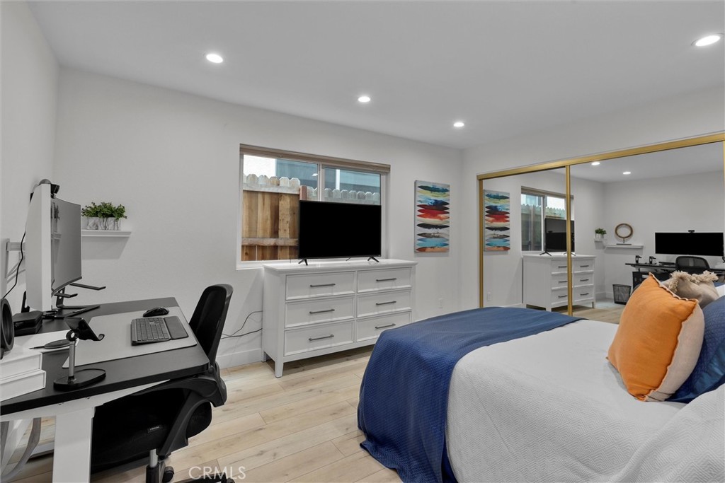 1727 Spreckels Lane Redondo Beach, CA 90278 - Photo 28 of 35 a bedroom with a bed and a flat screen tv