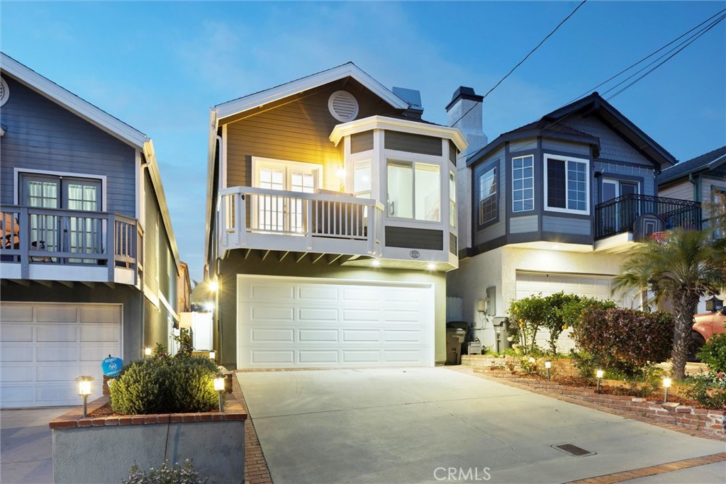 1727 Spreckels Lane Redondo Beach, CA 90278 - Photo 33 of 35 a front view of a house with garage and plants