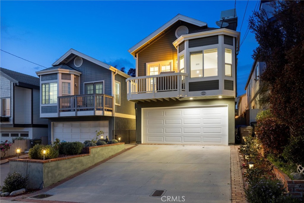 1727 Spreckels Lane Redondo Beach, CA 90278 - Photo 34 of 35 a front view of a house with a yard and garage