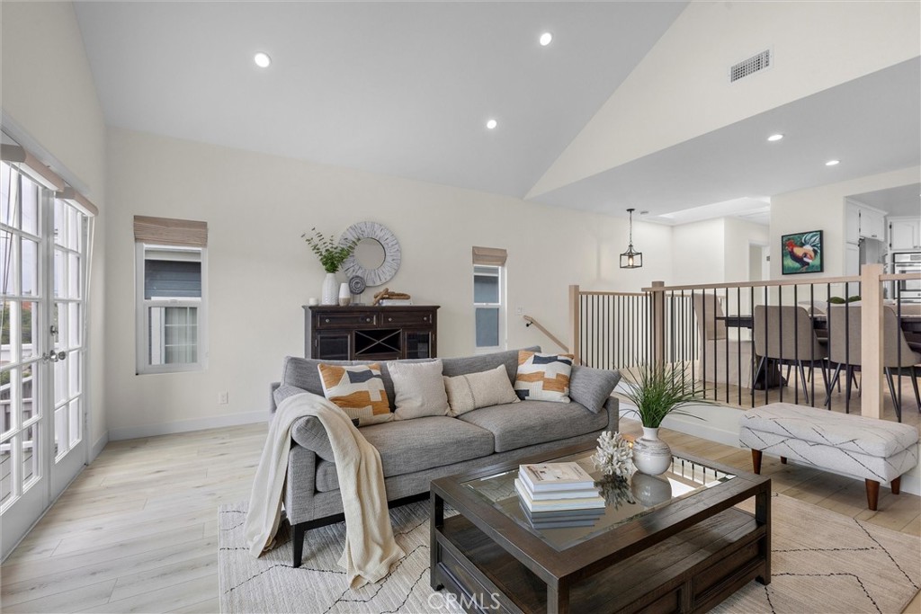 1727 Spreckels Lane Redondo Beach, CA 90278 - Photo 4 of 35 a living room with furniture and a wooden floor