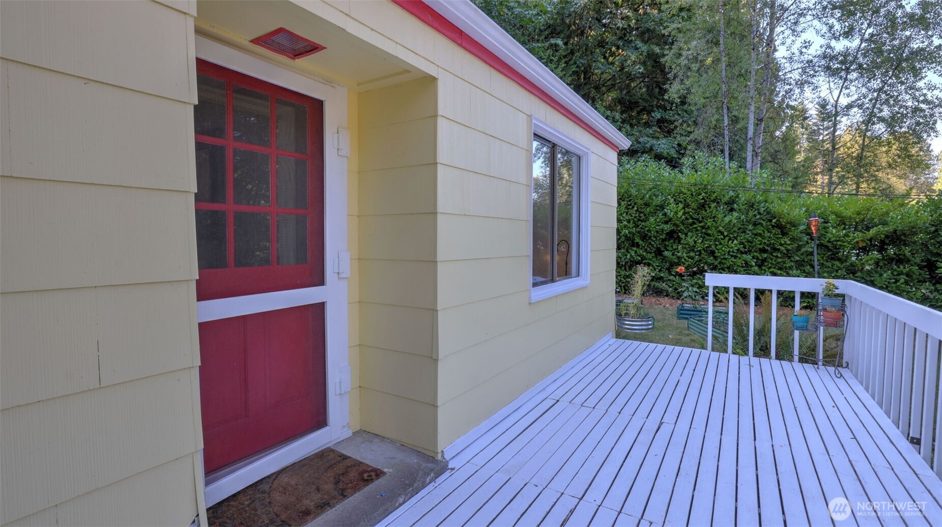 12450 186th Place Southeast Renton, WA 98059 - Photo 2 of 22 a balcony with wooden floor
